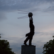 A statue representing a man holding the Sputnik satellite, the namesake of the Sputnik V vaccine, is seen after sunset on June 7, 2018 in Samara, Russia